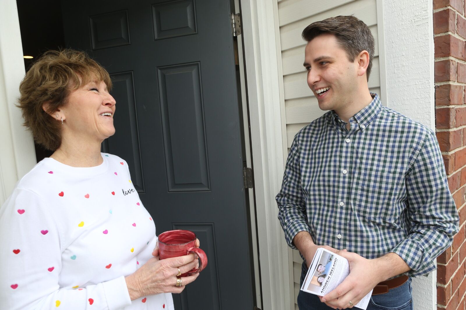 Andrew Ireland talking with a District 90 resident